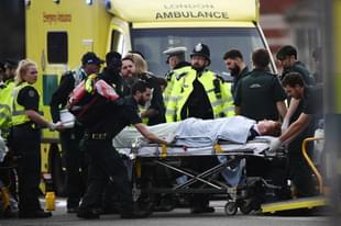 A member of the public is treated by emergency services near Westminster Bridge and the Houses of Parliament after the terror attack. (Carl Court/GettyImages)  